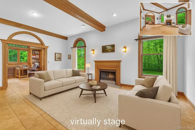 a living room with furniture and a fireplace