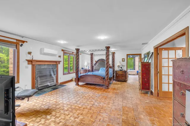a bedroom with furniture and a fireplace
