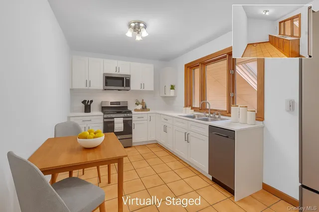 a living room with furniture a fireplace and a window