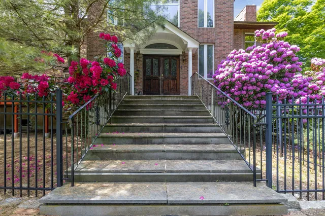 a view of an empty room with window and bathroom