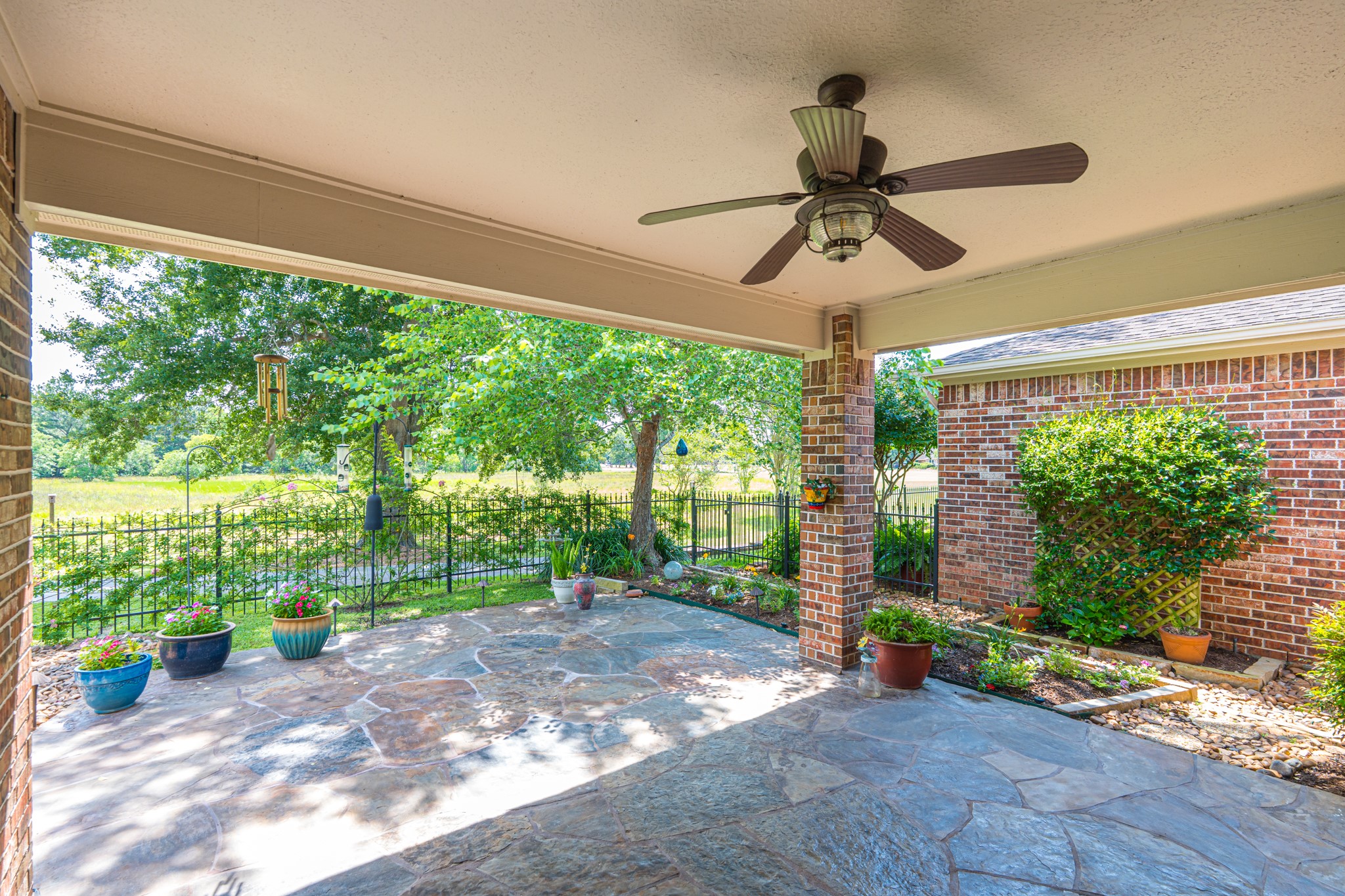20714 Flora View Court Spring, TX 77379 - Photo 37 of 40 a view of a porch with a fireplace in the patio