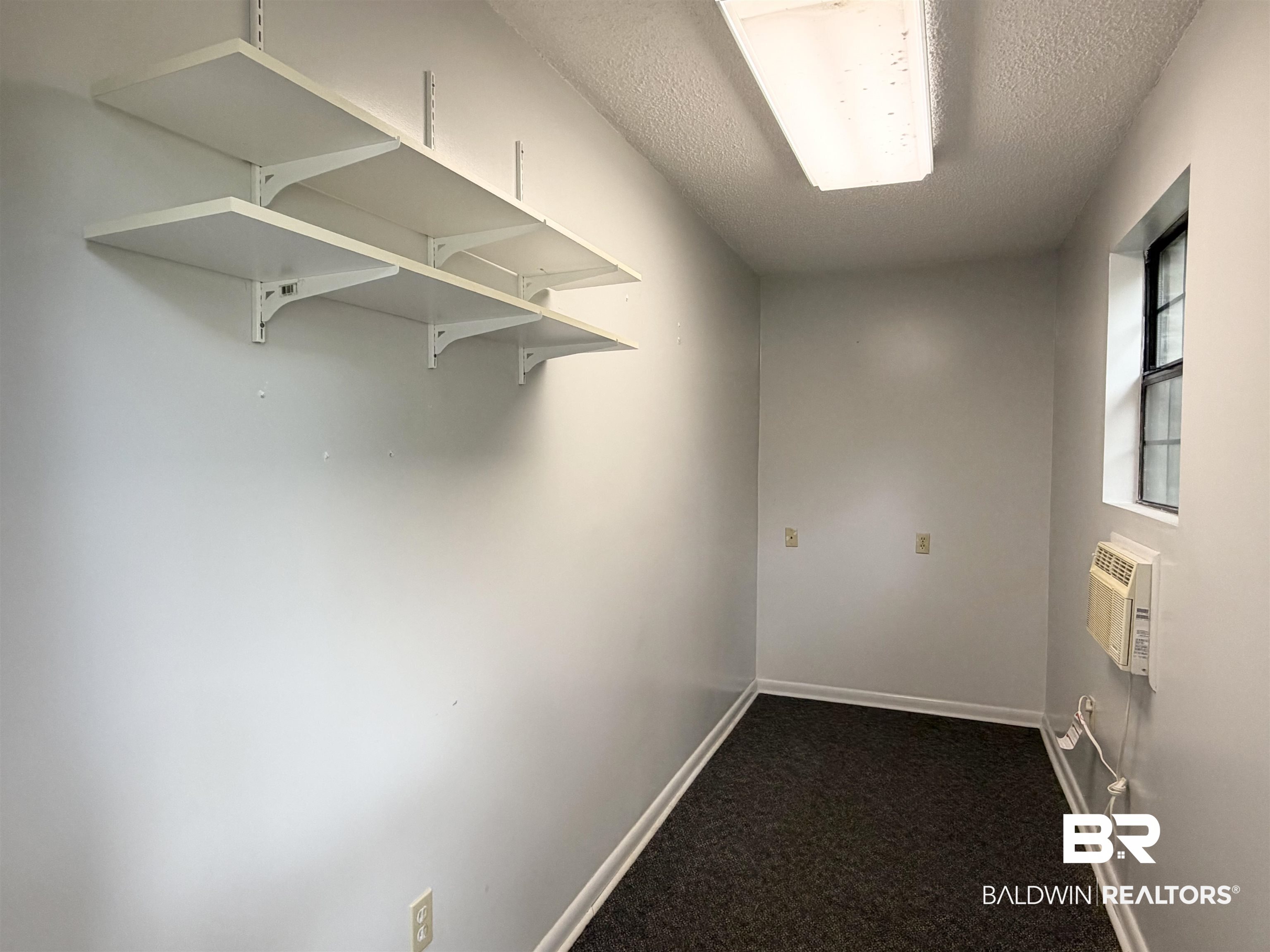 1075 Zurich Street Mobile, AL 36608 - Photo 27 of 35 Walk in closet with dark colored carpet