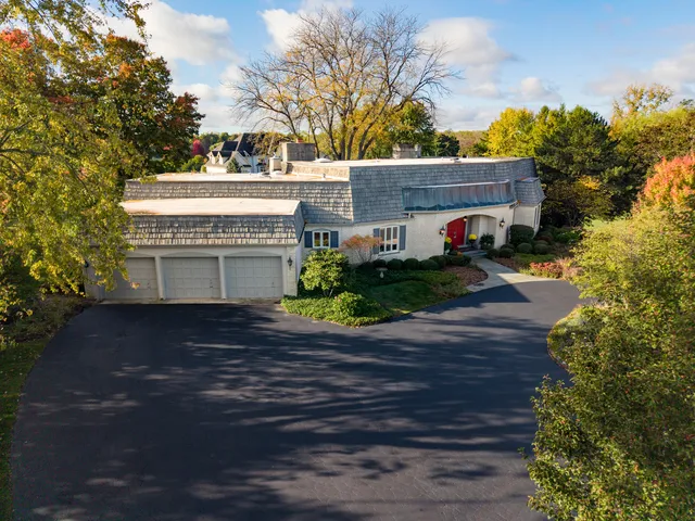 a view of a house with a yard and garage