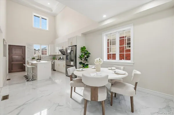 a view of a dining room with furniture and window
