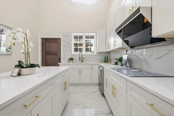 a kitchen with a sink and cabinets