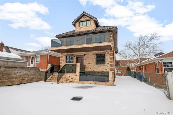 a view of a building with a snow on the road