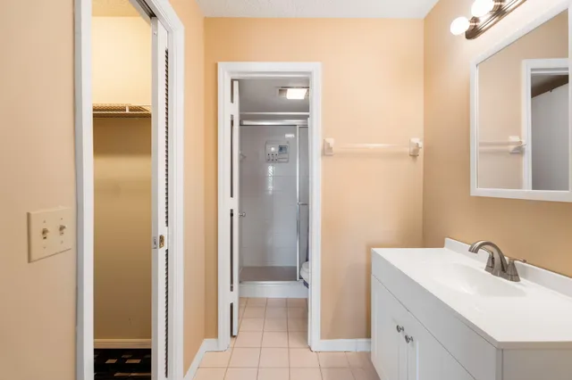 a bathroom with a toilet and a shower curtain