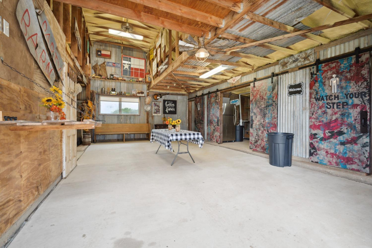 9002 Woodrow Road Wolfforth, TX 79382 - Photo 32 of 48 a view of a room with racks on the wall