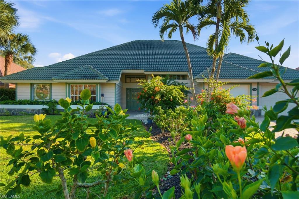 a view of house with swimming pool