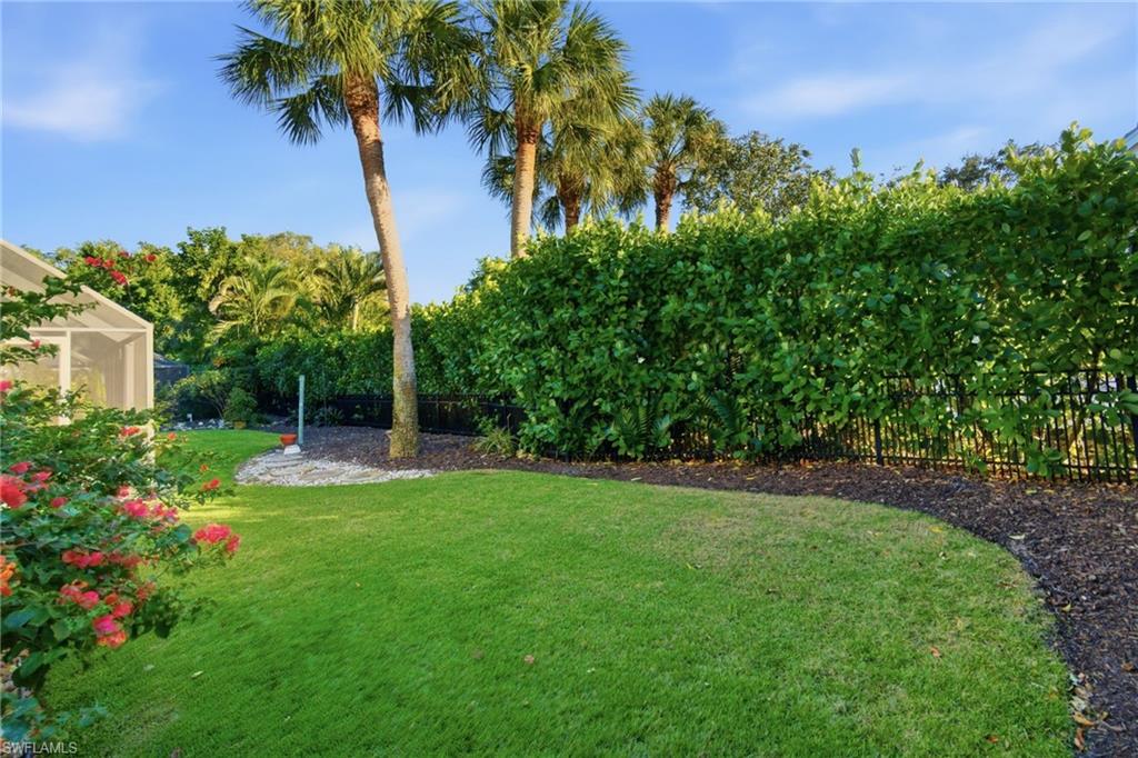 716 Pitch Apple Lane Naples, FL 34108 - Photo 14 of 36 a view of a garden with a flower in a garden