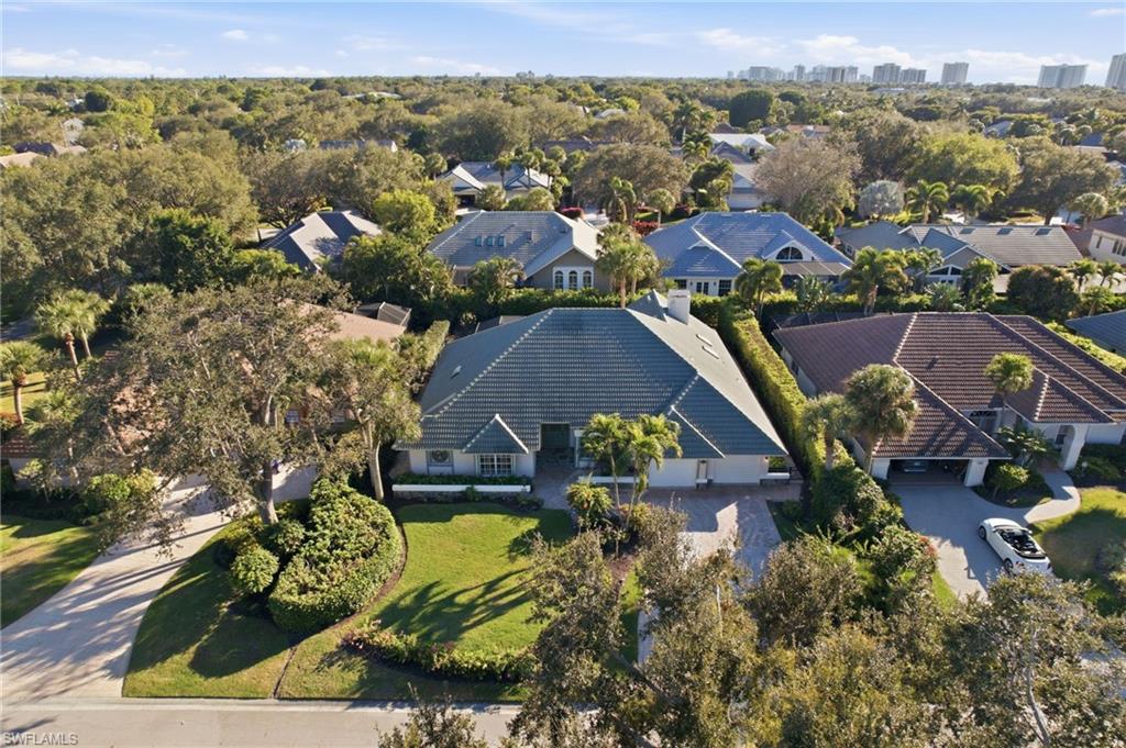 716 Pitch Apple Lane Naples, FL 34108 - Photo 2 of 36 an aerial view of residential houses with outdoor space and street view