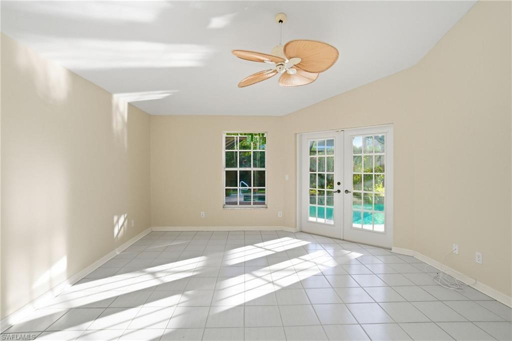 716 Pitch Apple Lane Naples, FL 34108 - Photo 21 of 36 a view of an empty room with a window