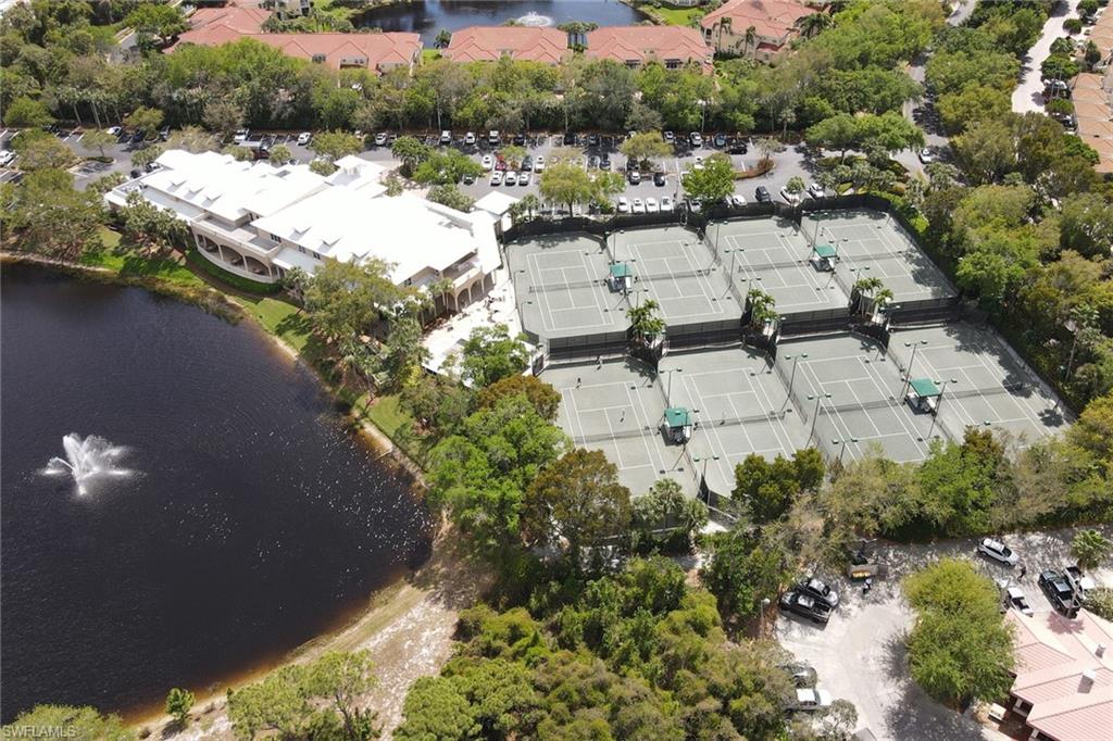 716 Pitch Apple Lane Naples, FL 34108 - Photo 28 of 36 an aerial view of a house with a yard and lake view