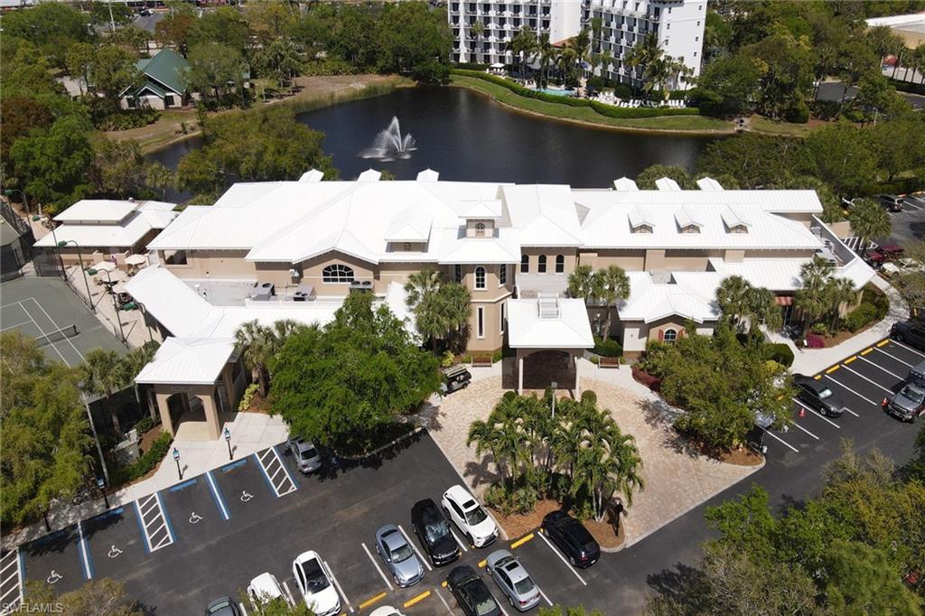 716 Pitch Apple Lane Naples, FL 34108 - Photo 30 of 36 an aerial view of lake and residential houses with outdoor space