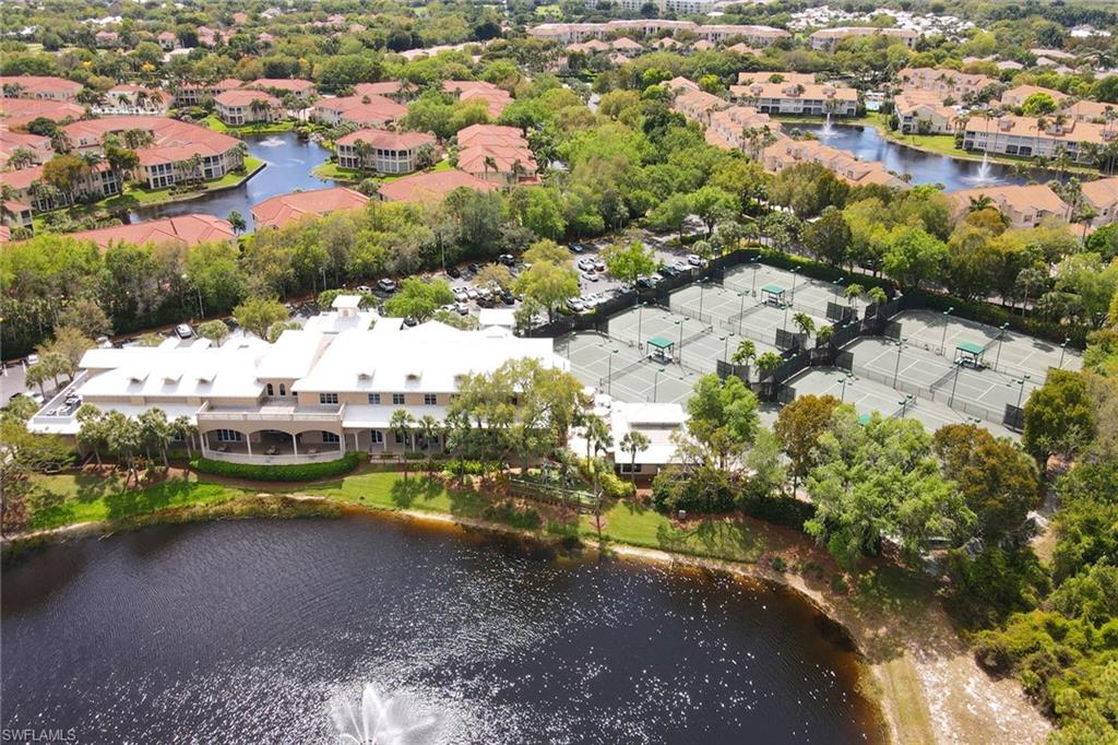 716 Pitch Apple Lane Naples, FL 34108 - Photo 34 of 36 a view of a lake with houses