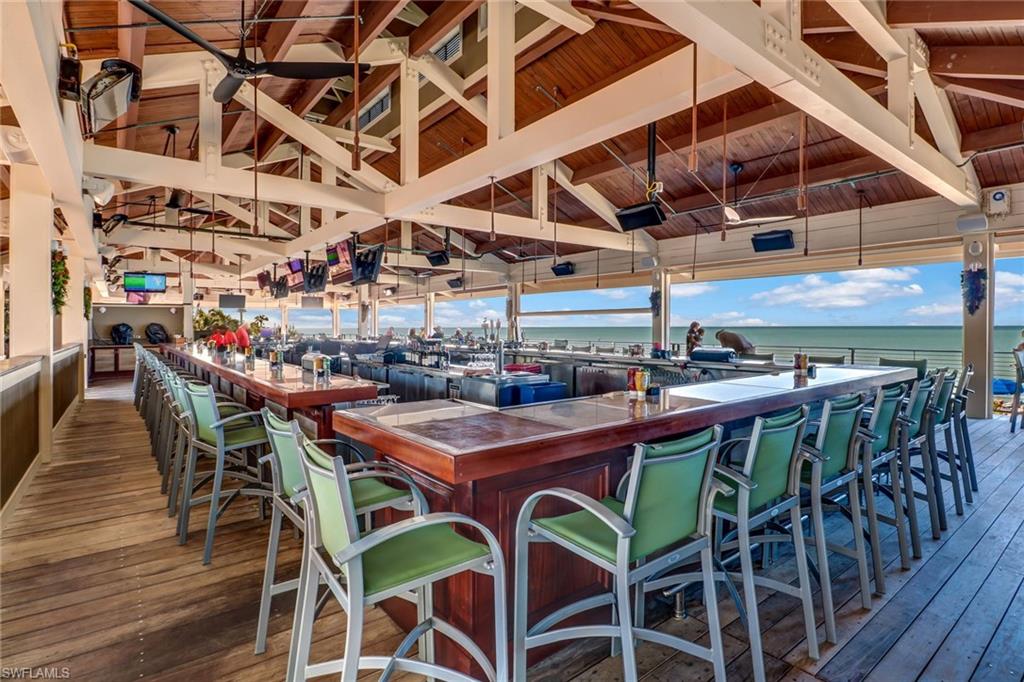 716 Pitch Apple Lane Naples, FL 34108 - Photo 7 of 36 a view of a dining room with furniture and kitchen view
