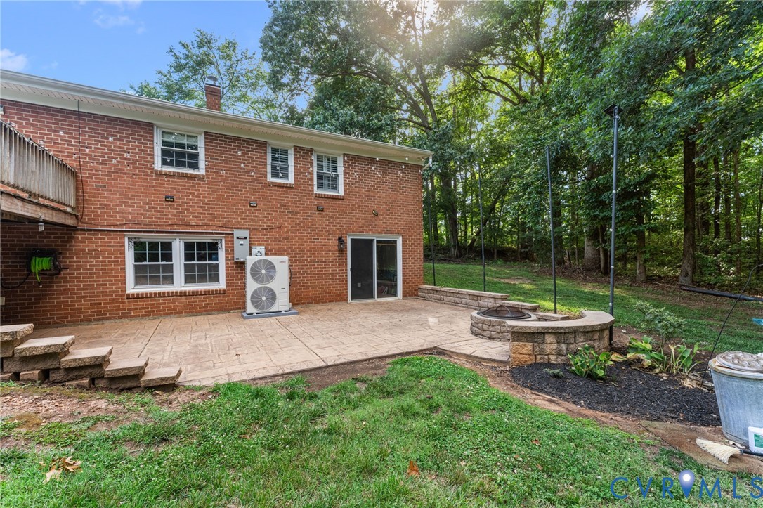 1496 Dorset Road Powhatan, VA 23139 - Photo 6 of 47 Expansive outdoor patio featuring stamped concrete