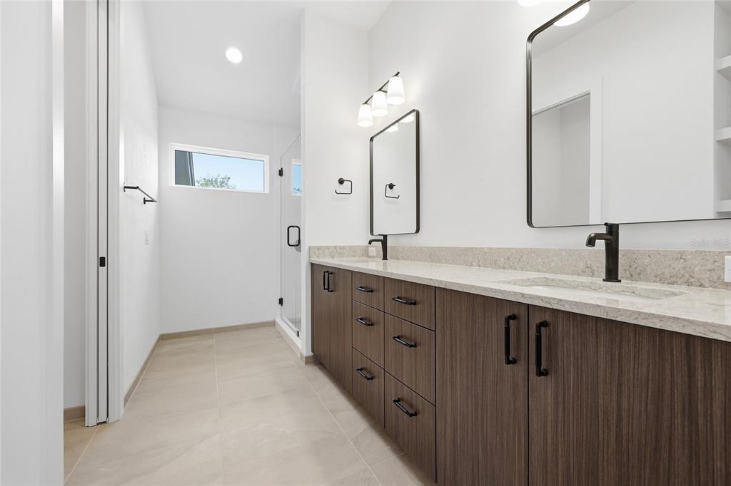 1063 Southwest 135th Way Newberry, FL 32669 - Photo 32 of 42 a spacious bathroom with double sink and mirror