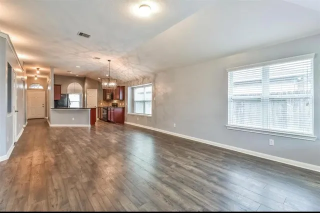 a view of a kitchen and a window