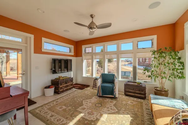 a kitchen with stainless steel appliances granite countertop a refrigerator a sink a stove and white cabinets