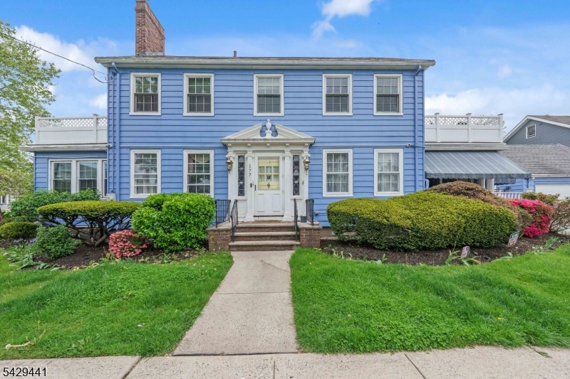 748 Livingston Road Elizabeth, NJ 07208 - Photo 1 of 45 a view of a house with a yard and plants