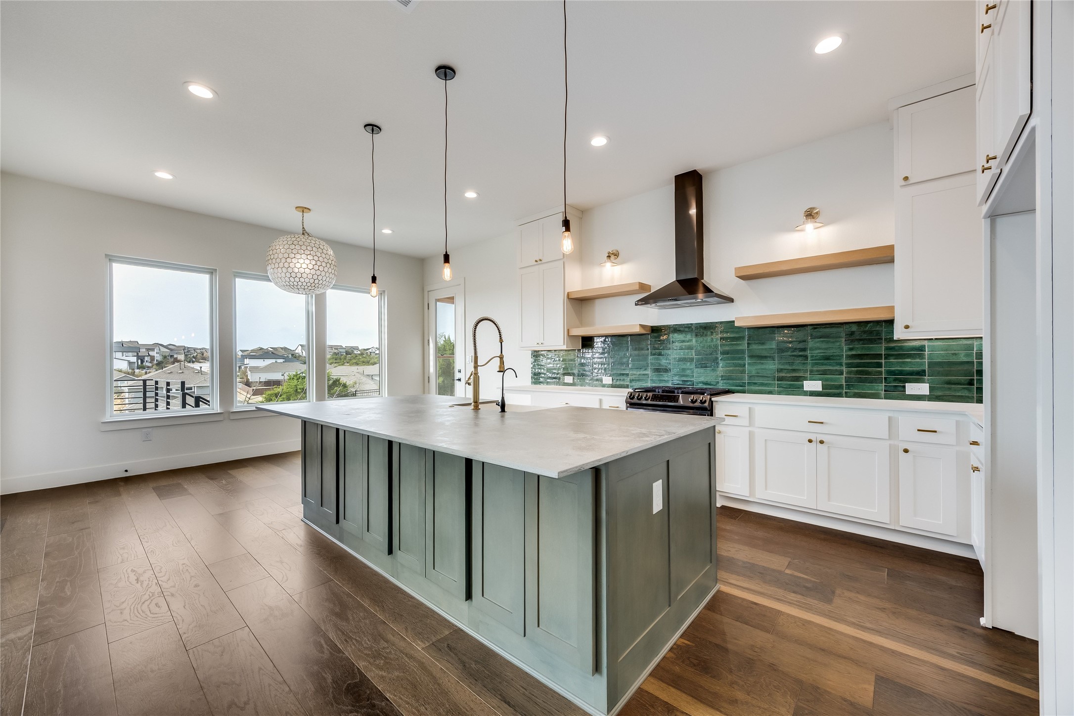 288 Smoke Tree Circle Dripping Springs, TX 78620 - Photo 8 of 40 a kitchen with stainless steel appliances granite countertop a sink a stove and a wooden floors