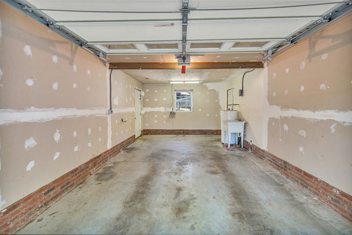 106 Pikes Ridge Anderson, SC 29626 - Photo 27 of 41 Concrete floors and a utility sink anchor this functional garage space.