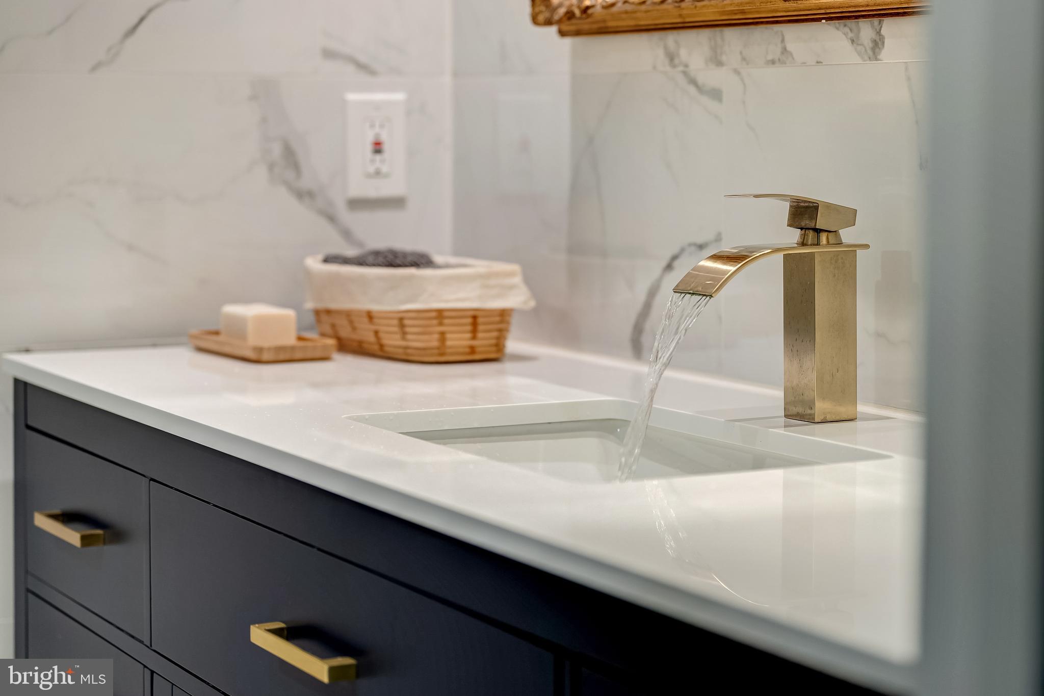 11464 Orchard Lane Reston, VA 20190 - Photo 44 of 64 a bathroom with a sink and a mirror