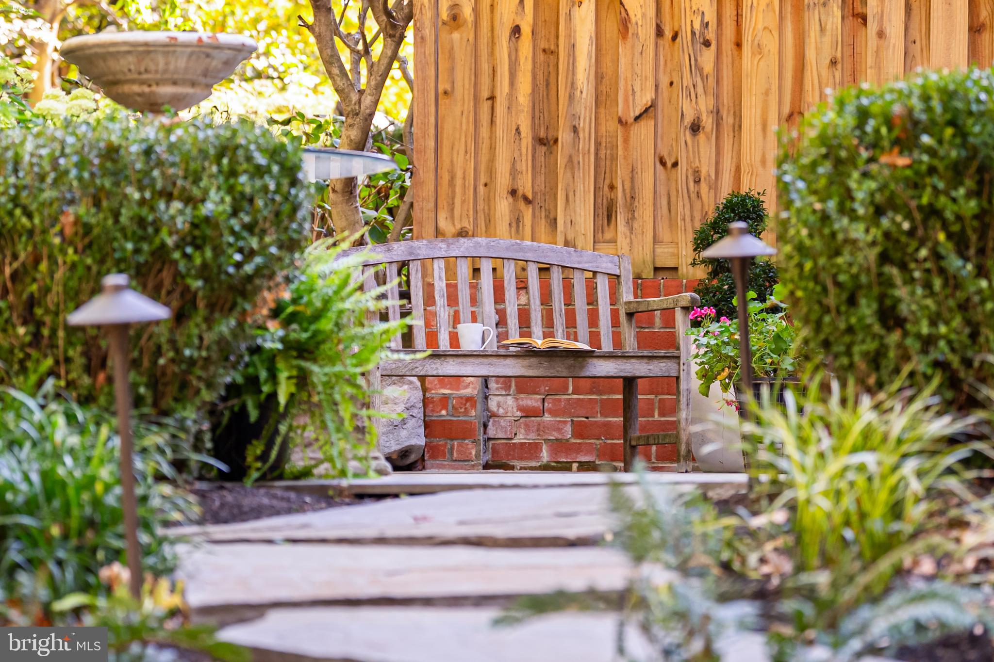 11464 Orchard Lane Reston, VA 20190 - Photo 49 of 64 a view of a house with a flower garden