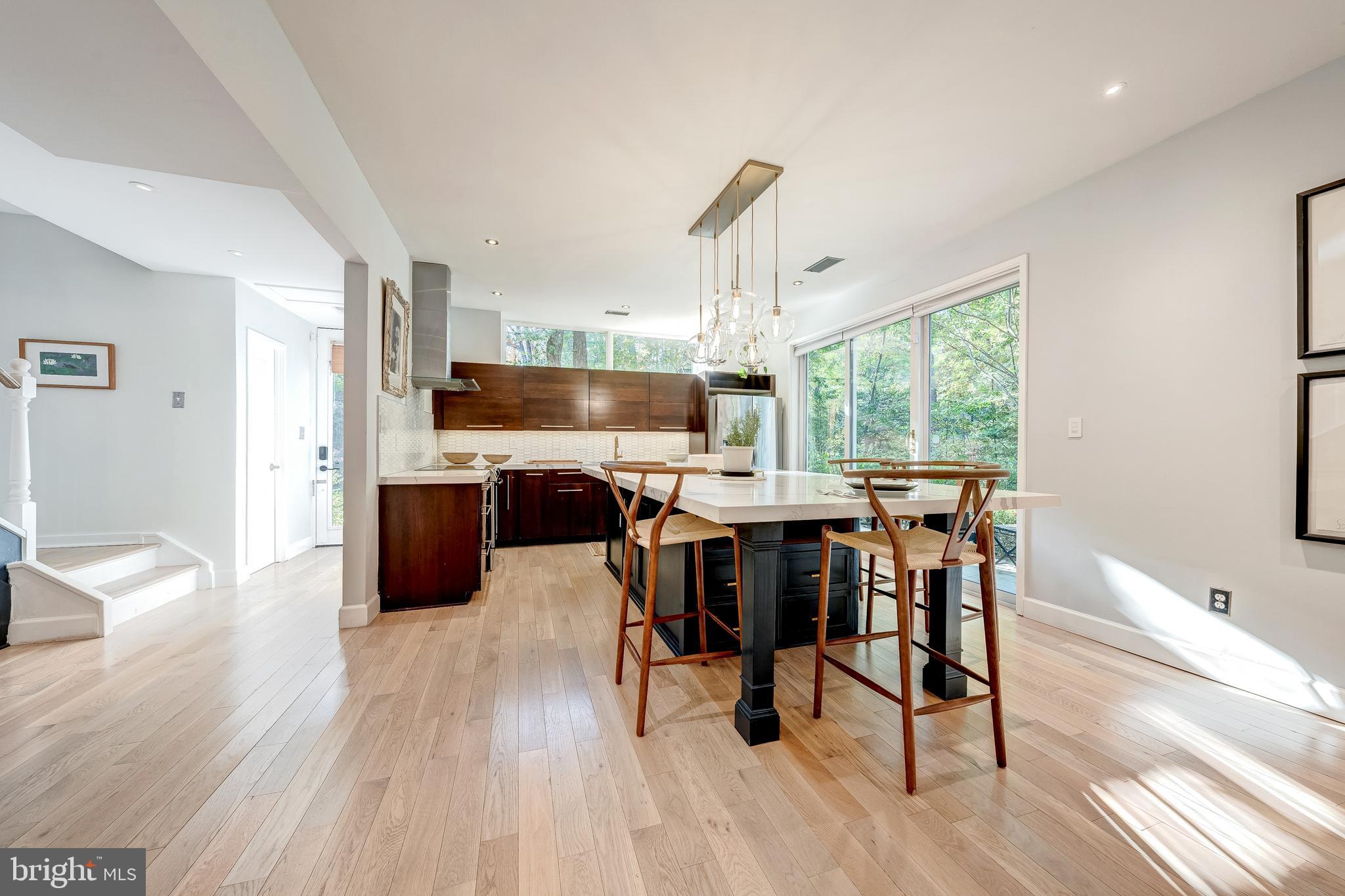 11464 Orchard Lane Reston, VA 20190 - Photo 8 of 64 a view of a dining room with furniture window and wooden floor