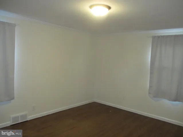 an empty room with a bench