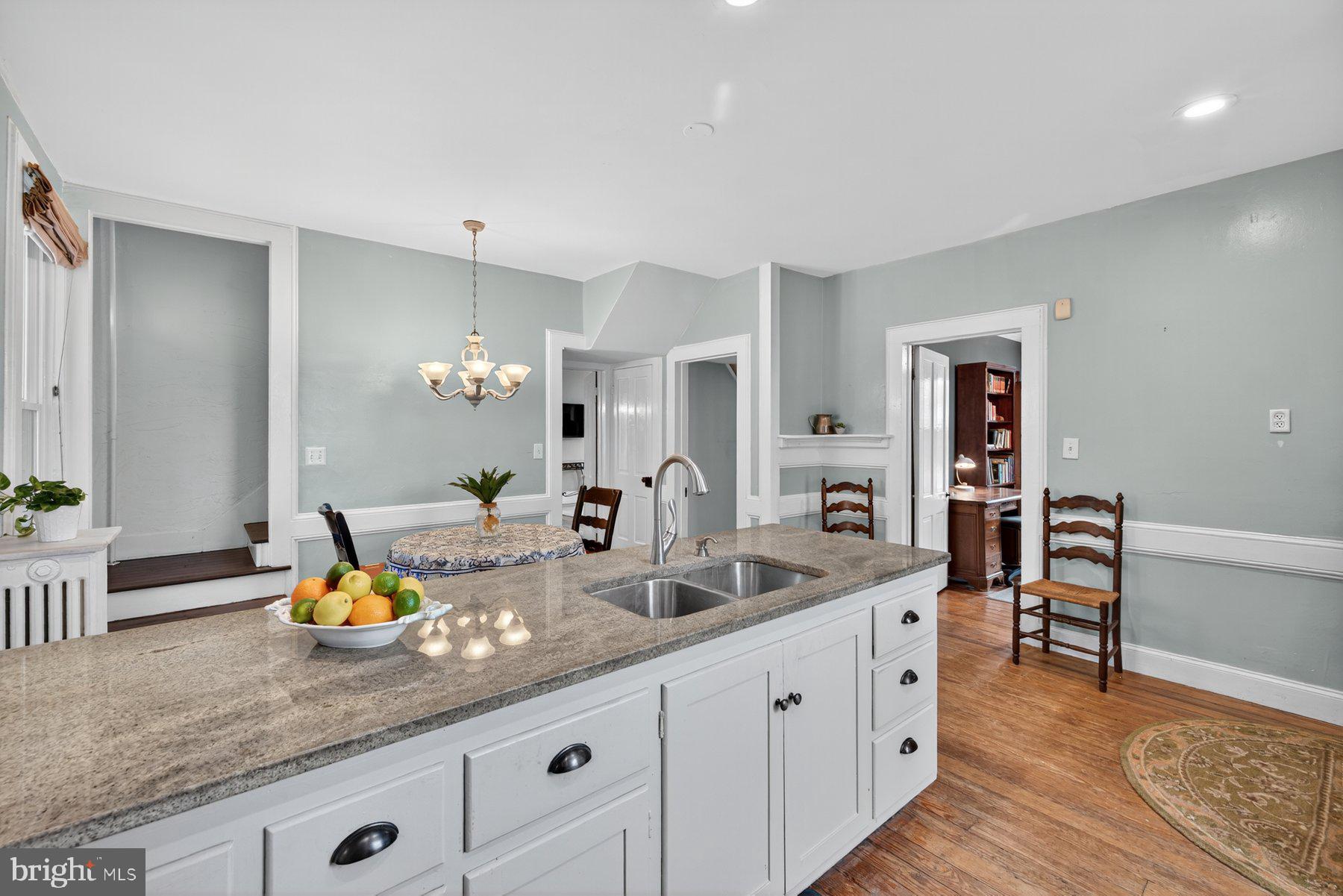 58 East Baltimore Street Taneytown, MD 21787 - Photo 14 of 56 a bathroom with a granite countertop sink and a mirror