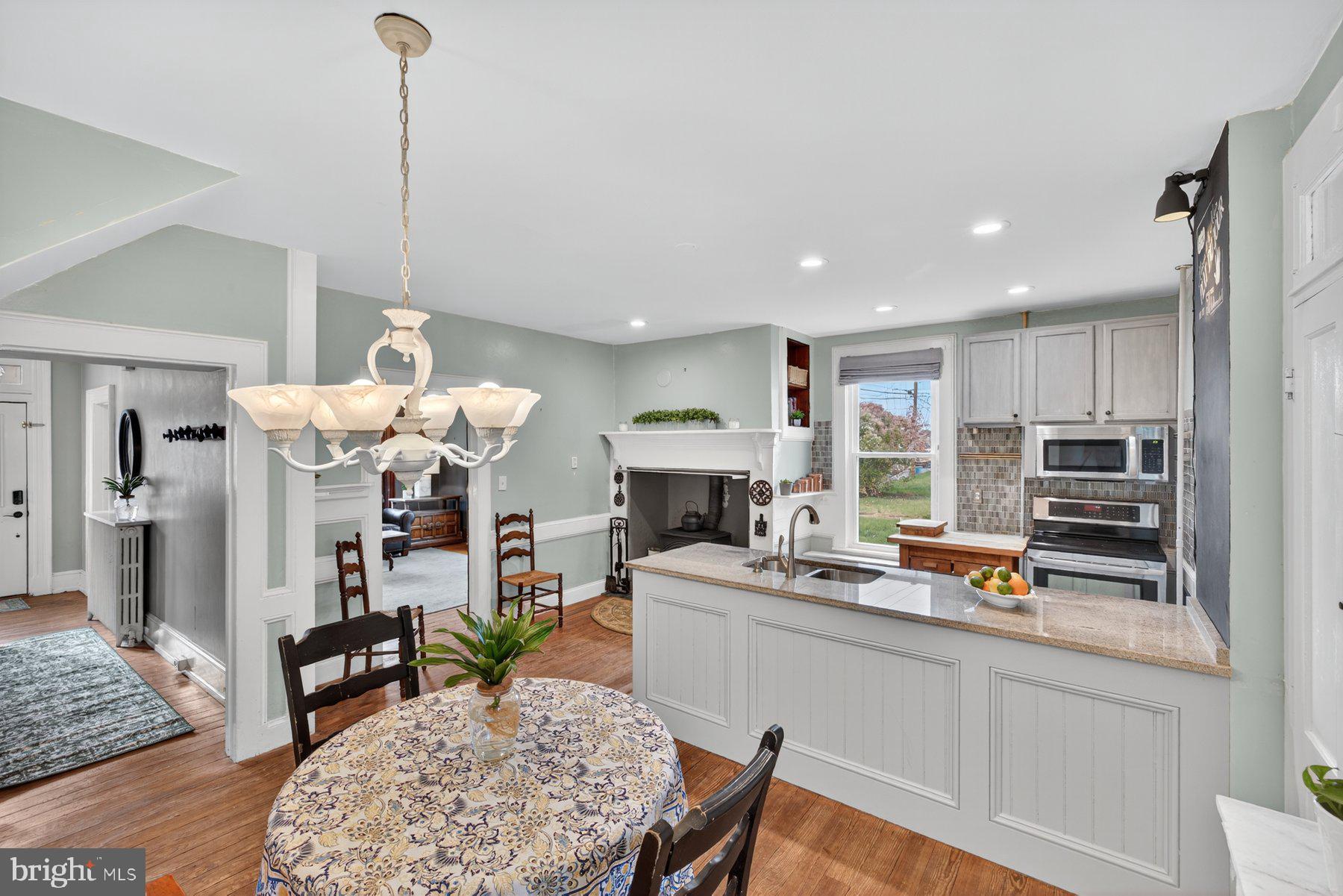 58 East Baltimore Street Taneytown, MD 21787 - Photo 16 of 56 a living room with fireplace furniture and a wooden floor