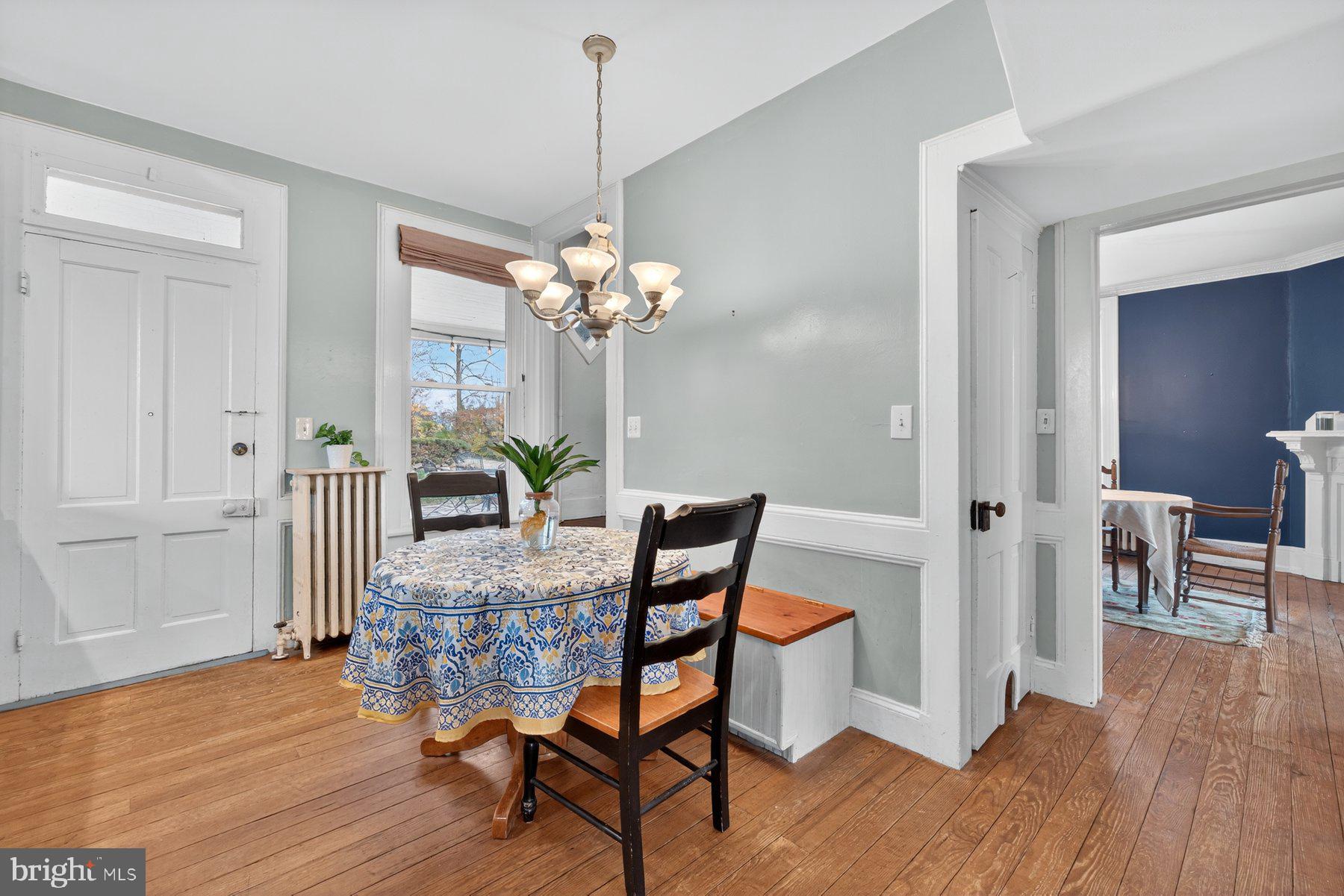 58 East Baltimore Street Taneytown, MD 21787 - Photo 17 of 56 a view of a dining room with furniture and wooden floor