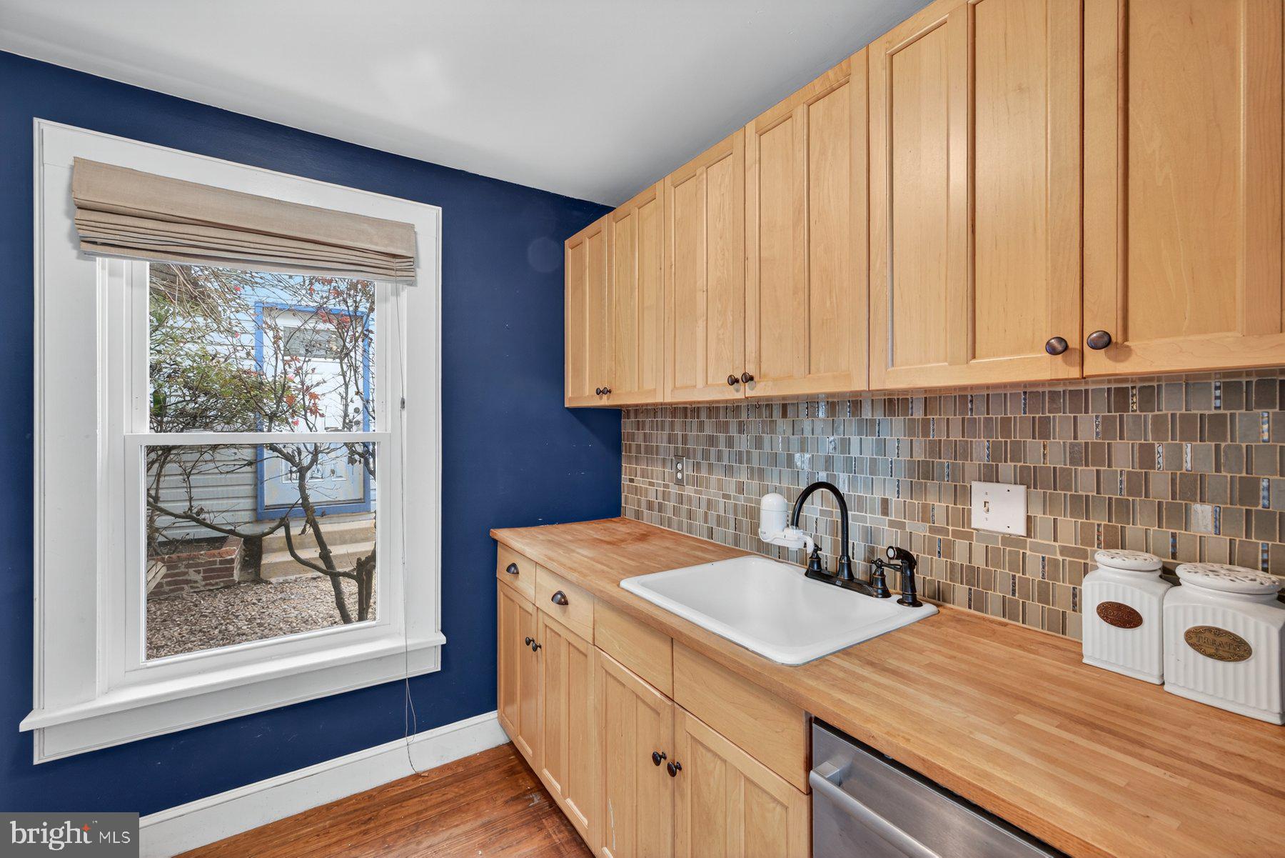 58 East Baltimore Street Taneytown, MD 21787 - Photo 18 of 56 a kitchen with a sink a stove and cabinets