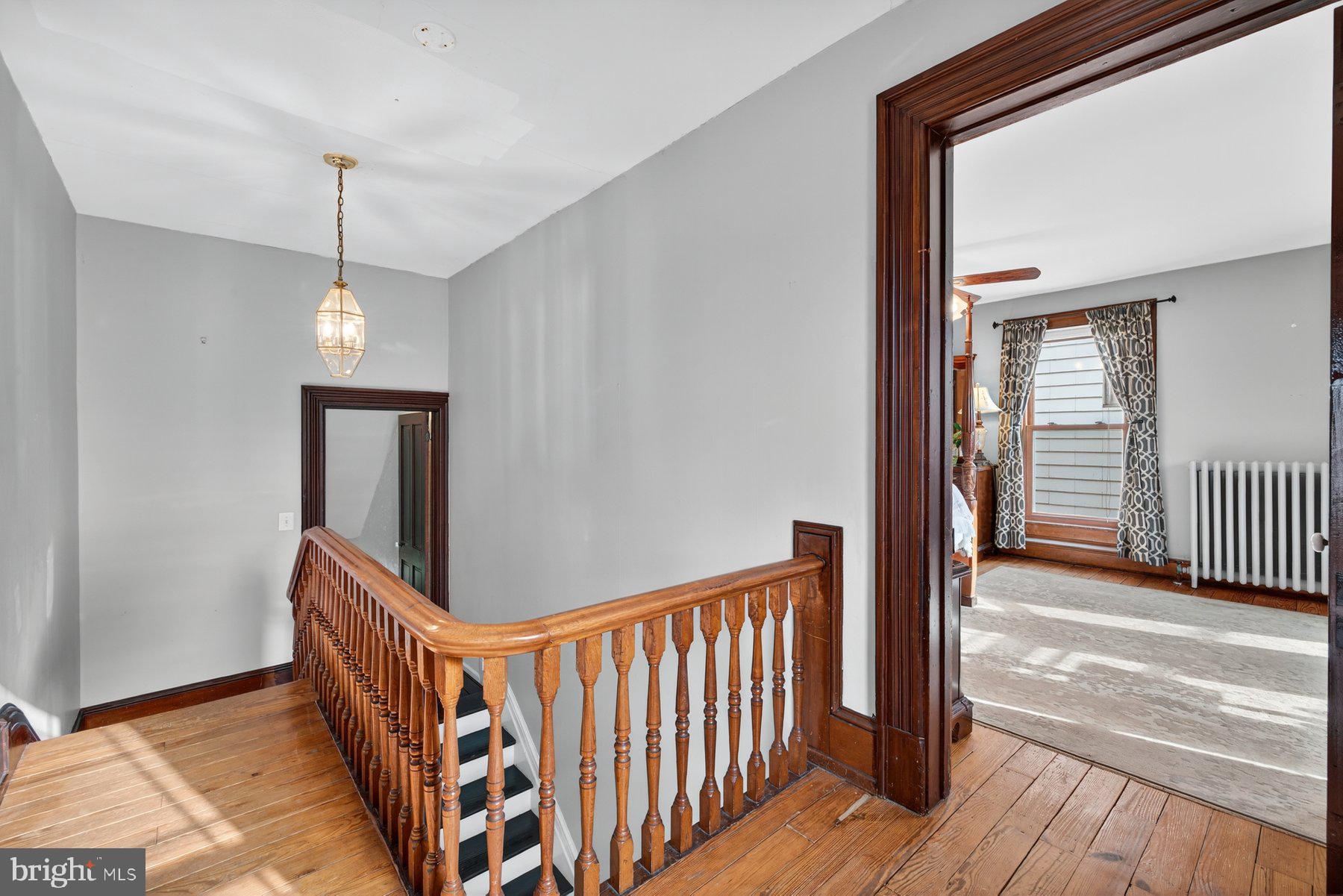 58 East Baltimore Street Taneytown, MD 21787 - Photo 22 of 56 a view of a hallway view with wooden floor and staircase