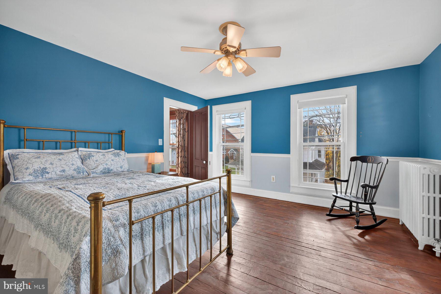 58 East Baltimore Street Taneytown, MD 21787 - Photo 31 of 56 a bed room with a bed and a chandelier