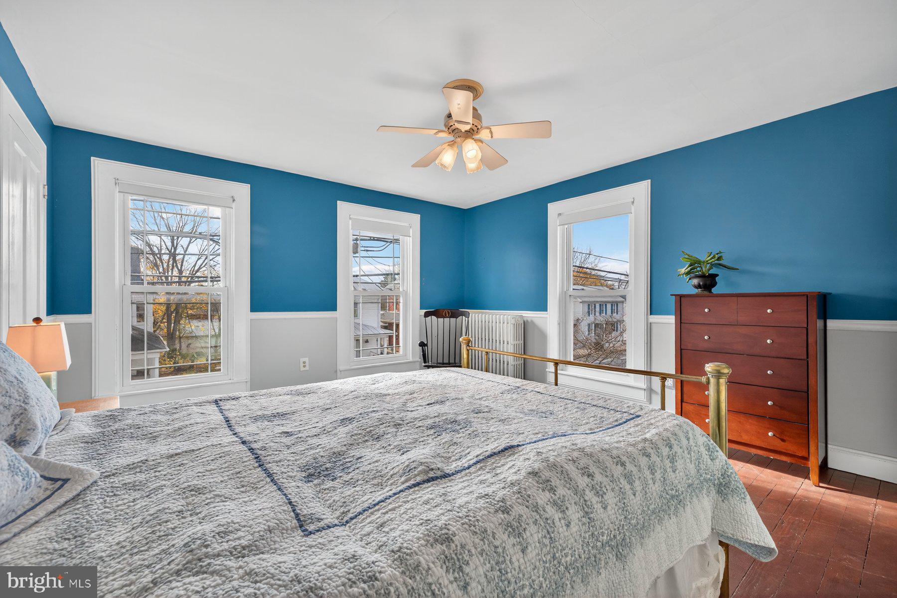 58 East Baltimore Street Taneytown, MD 21787 - Photo 32 of 56 a bedroom with a large bed and a dresser