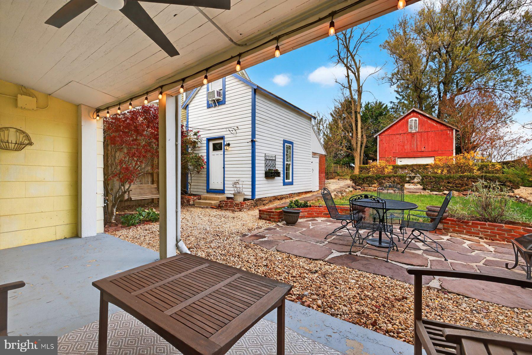58 East Baltimore Street Taneytown, MD 21787 - Photo 37 of 56 a view of a patio with table and chairs with wooden floor and fence