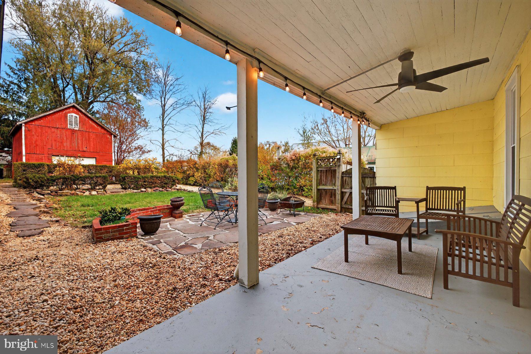 58 East Baltimore Street Taneytown, MD 21787 - Photo 39 of 56 a view of a patio with a table chairs and a backyard