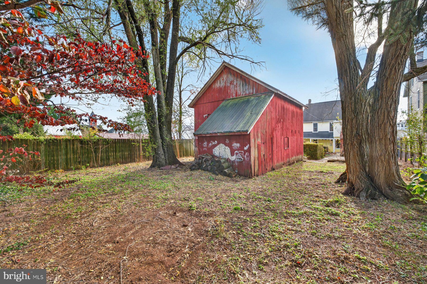 58 East Baltimore Street Taneytown, MD 21787 - Photo 45 of 56 a backyard of a house with lots of green space and fountain