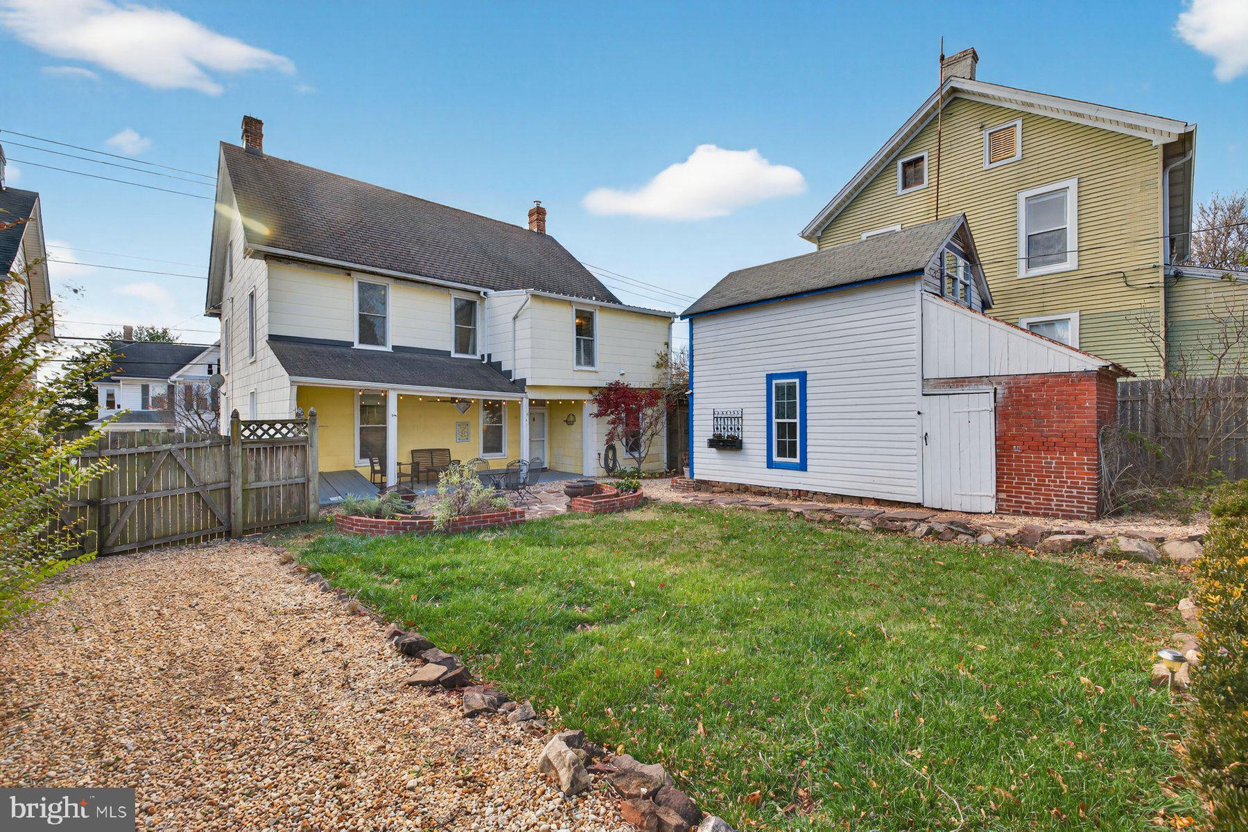 58 East Baltimore Street Taneytown, MD 21787 - Photo 48 of 56 a view of a house with a yard and sitting area
