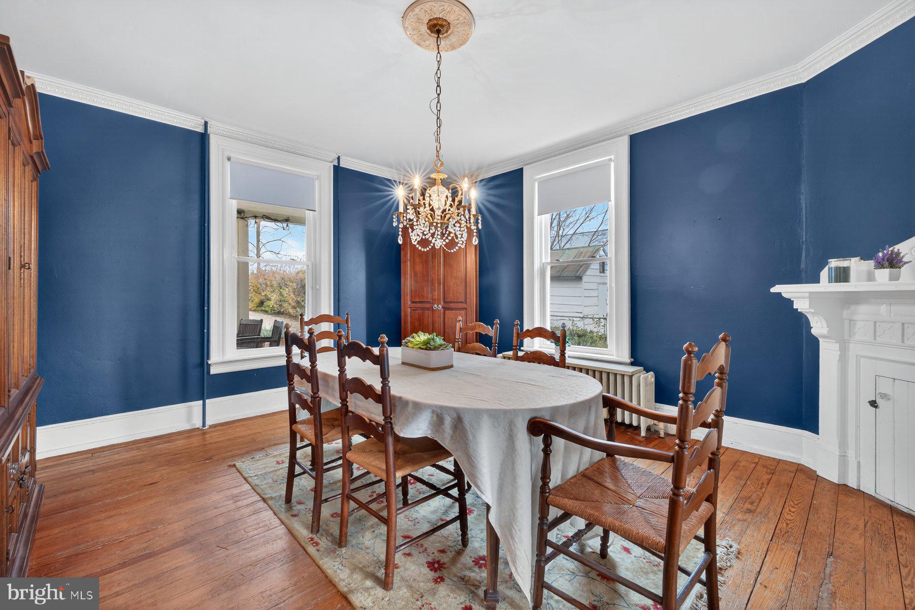 58 East Baltimore Street Taneytown, MD 21787 - Photo 8 of 56 a view of a dining room with furniture window and wooden floor