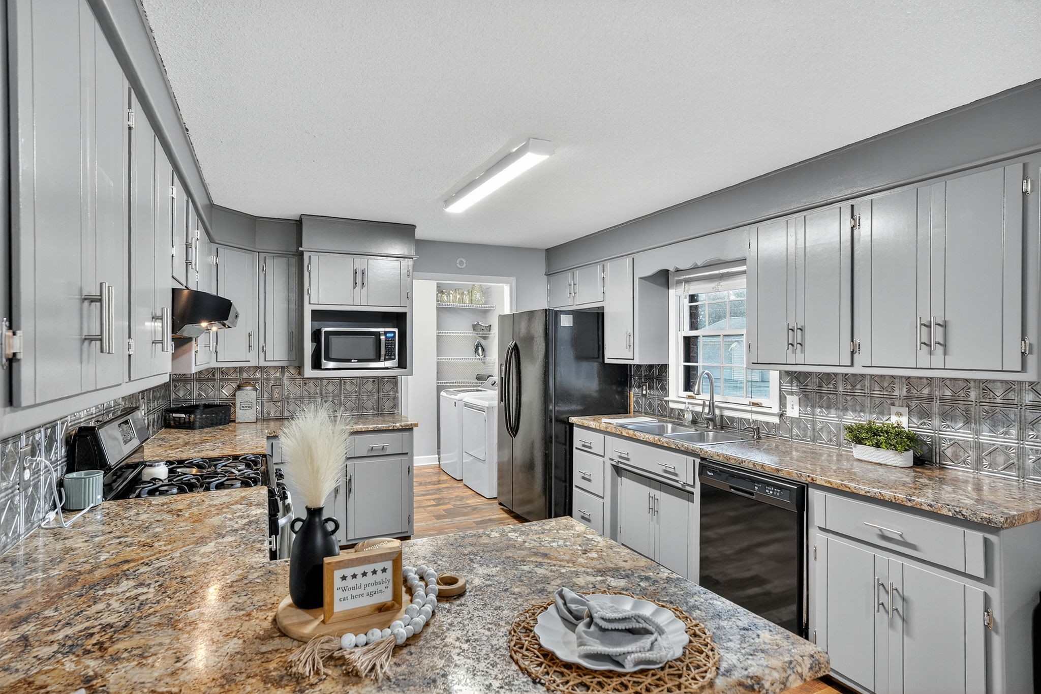 93 Jean Drive Tullahoma, TN 37388 - Photo 19 of 53 a kitchen with stainless steel appliances kitchen island granite countertop a sink dishwasher stove and refrigerator with wooden floor