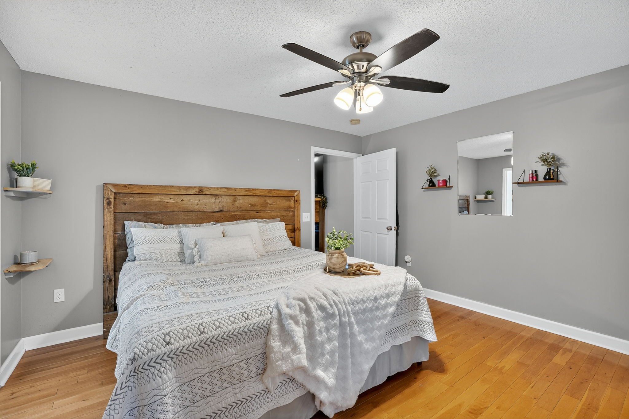 93 Jean Drive Tullahoma, TN 37388 - Photo 23 of 53 a bedroom with a large bed and a chandelier