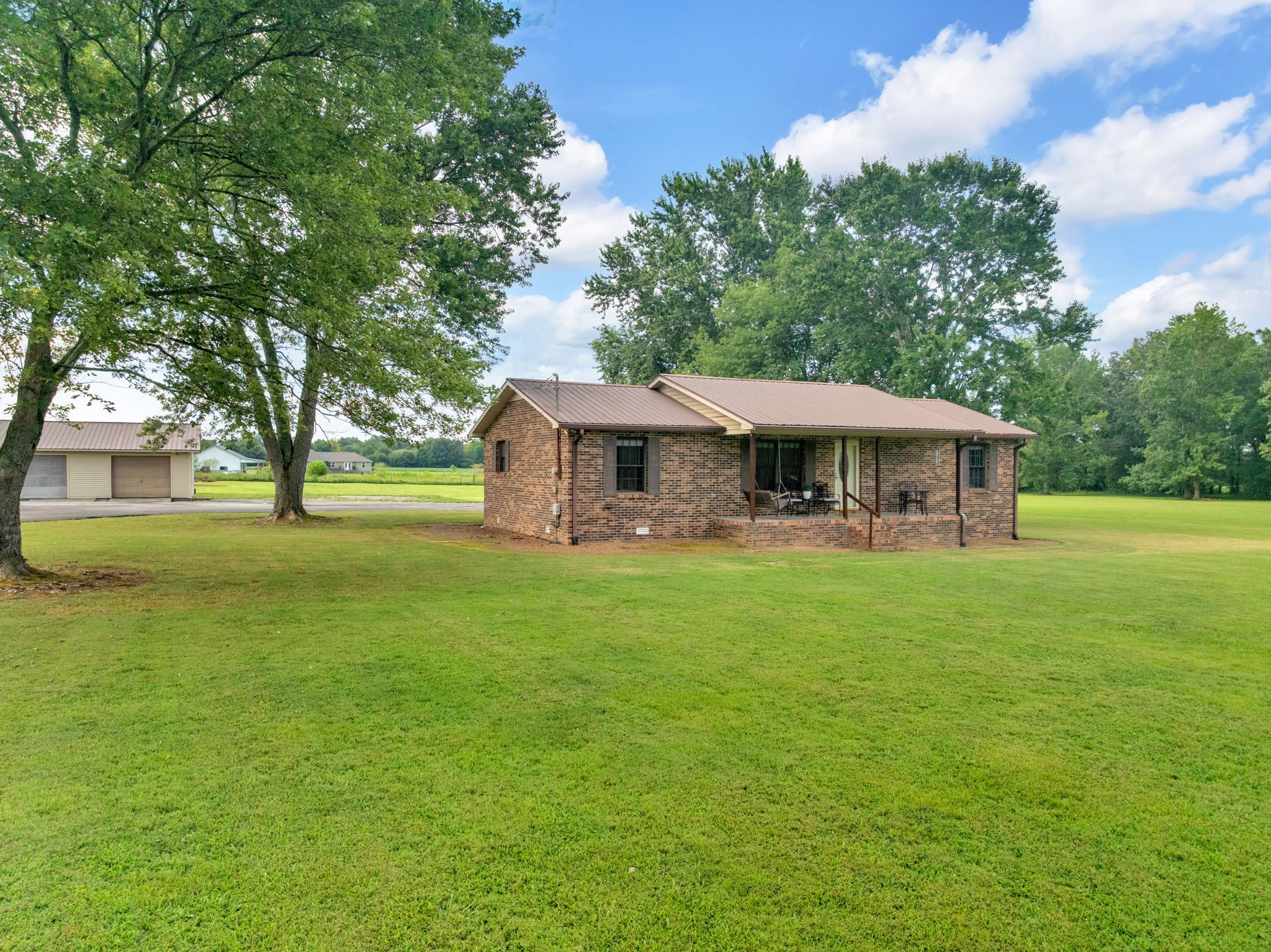 93 Jean Drive Tullahoma, TN 37388 - Photo 3 of 53 a front view of a house with a garden