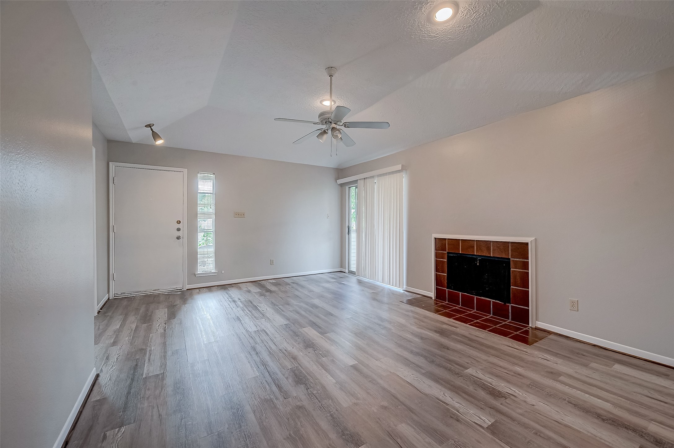 11503 Meadow Lane, Unit D Houston, TX 77477 - Photo 13 of 39 wooden floor in an empty room with a window