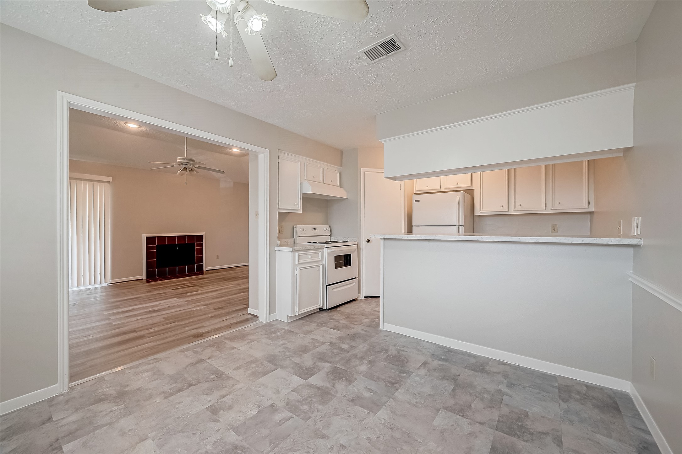 11503 Meadow Lane, Unit D Houston, TX 77477 - Photo 14 of 39 a view of a kitchen with a sink and a refrigerator