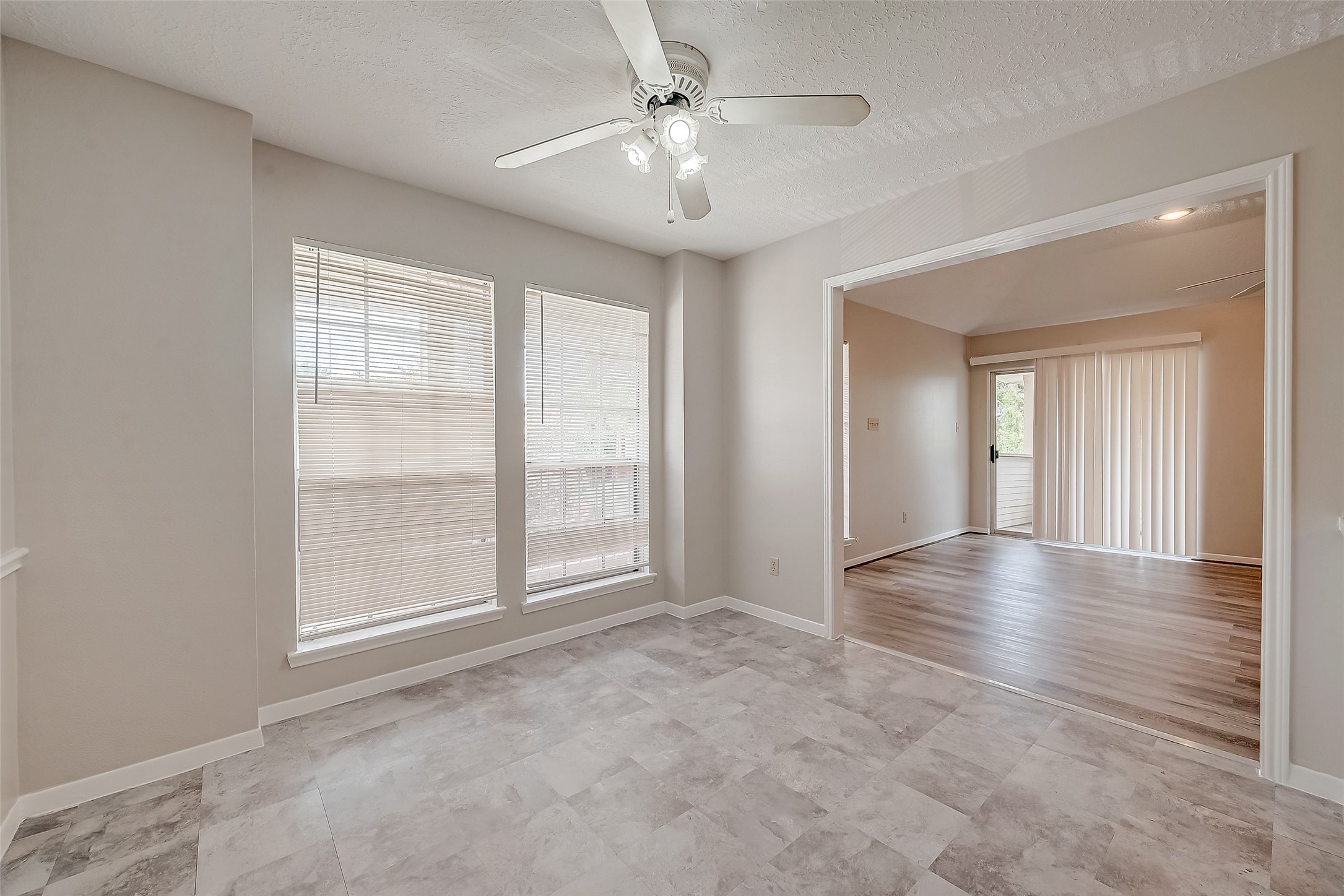 11503 Meadow Lane, Unit D Houston, TX 77477 - Photo 16 of 39 wooden floor in an empty room with a window