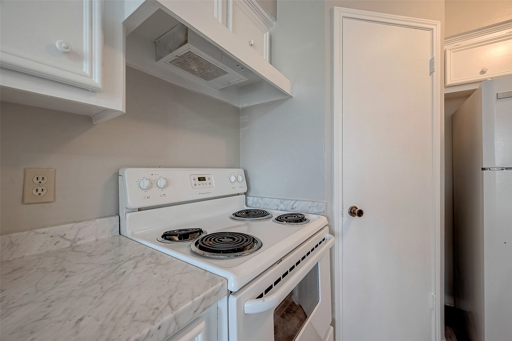 11503 Meadow Lane, Unit D Houston, TX 77477 - Photo 19 of 39 a white stove top oven sitting inside of a kitchen